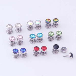 Detailed flat lay of colorful crystal dumbbell stud earrings in various bright shades