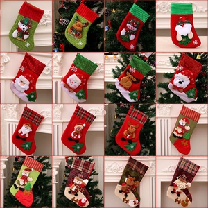 Variety of festive Christmas stockings featuring Santa, snowman and reindeer designs