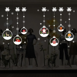 Christmas window decals with Santa and reindeer on glass for festive shop decoration