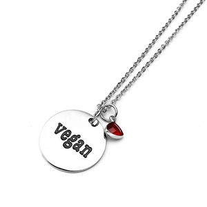 Silver necklace with red teardrop birthstone and engraved Vegan circle pendant