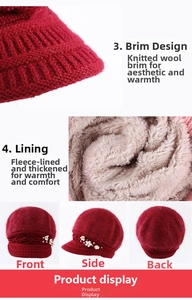 Detail of wine red knit hat showing velvet lining, pearl floral decor and visor brim