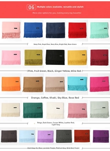 Macro shot showing diverse colorful cashmere scarf options with fringed edge details