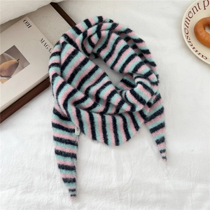 Detail of soft three-color striped knit scarf in pink, mint green and dark blue wool