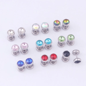 Macro view of stainless steel barbell earrings with various colored faceted crystals