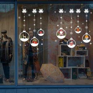 White Christmas crystal ball window decals featuring bells, snowflakes and Santa Claus patterns