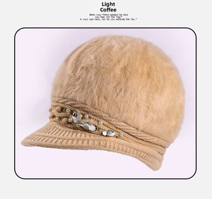 Detail of light coffee winter hat featuring plush texture, knit brim, and pearl flower accent