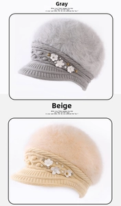 Detail of winter knitted visors in grey and beige with faux fur and pearl flowers
