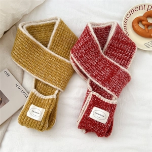 Narrow thick knit scarf with pocket design and contrasting trim in ginger and dark red