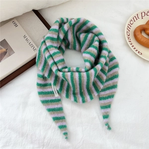 Close-up of three-color striped knit triangle scarf with soft mohair wool texture