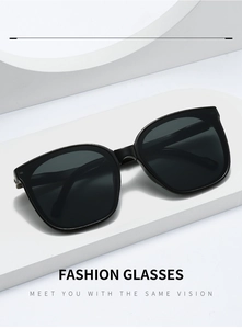 Close-up of black folding sunglasses showing metallic hinges and sleek square frames
