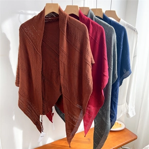 Hollow-out knitted triangle shawl available in five earthy tones for versatile layering