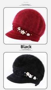 Detail of wine red and black knitted beanies with pearl flower decor and visor