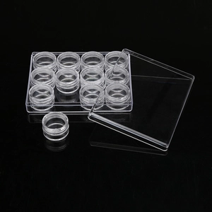 Set of 12 transparent plastic jars in a rectangular storage box for cosmetic travel
