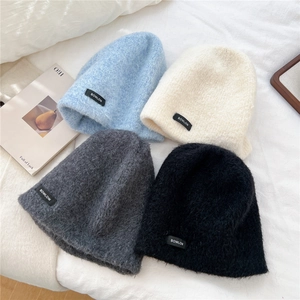 Thick warm mohair knit beanie hats for women in four colors on a white bedding background