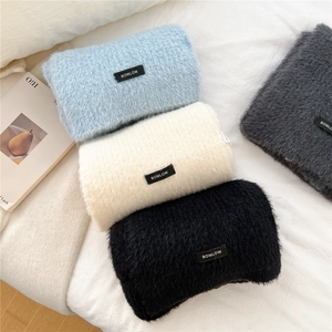 Detail of soft wool blend knit hats showing four colors and the BOWLOW woven label