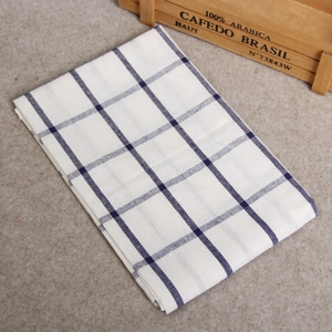 Close-up of blue and white checkered cotton linen napkin with soft woven texture