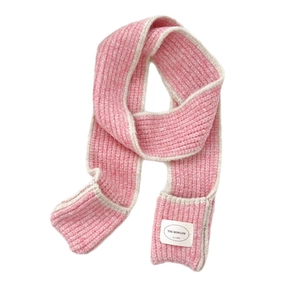 Pink and beige striped knit scarf featuring thick woven texture and branded label detail