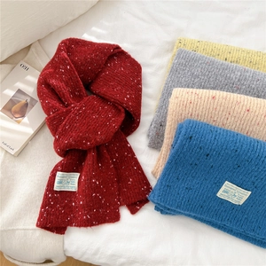 Thick knit winter scarf for women in multicolor speckled wool with brand label detail