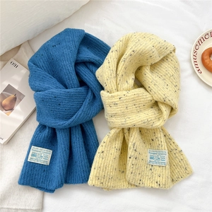 Thick knit long scarves in solid blue and beige speckled styles for winter warmth