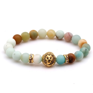 Lion head beaded bracelet with natural tiger eye and turquoise stones on white background