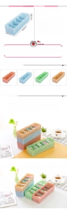 Detailansicht stapelbarer PP-Organizer mit 5 Fächern in Pink, Blau, Grün und Beige