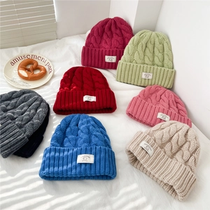 Chunky knit 100% wool beanies in multiple colors with cuffed brim and woven label