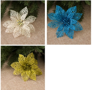 Detail of 13cm hollow artificial poinsettia in white, blue and gold with glitter texture