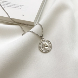 925 sterling silver coin pendant necklace with vintage embossed portrait on white silk