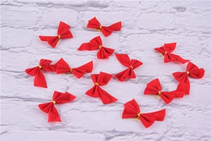 Set of 12 red ribbon Christmas bows with gold ties for festive holiday decorations