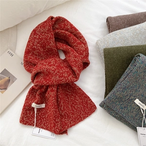 Thick knitted 100% wool scarf in warm red color with premium soft texture for winter