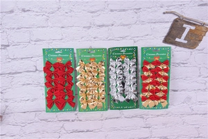 Close-up of red, gold, and silver flocked velvet Christmas bows in a 12-piece card set