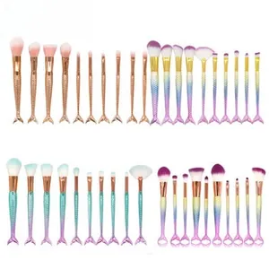 Detail of fish tail makeup brush handles with scale texture in four gradient colors