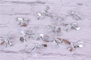 Close-up of shiny silver fabric bows decorations for Christmas trees and crafts