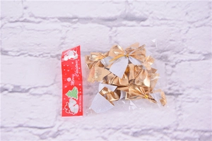 Close-up of gold and silver metallic woven Christmas bows in clear plastic packaging