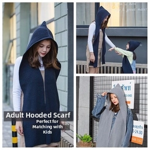 Detail of hooded knit scarves in navy and grey for adults and kids in outdoor setting