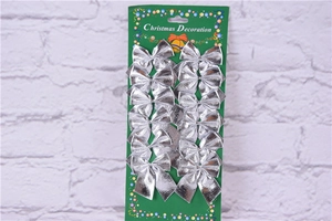 Detailed view of silver Christmas bows in a 12-piece set for tree decoration