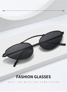 Detail of minimalist cat-eye sunglasses with sleek black metal frames and double bridge design