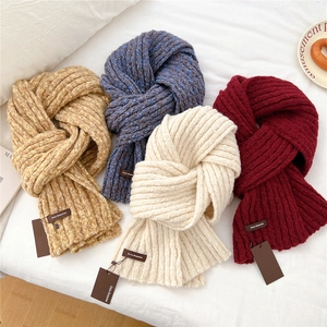 Thick knit winter scarf for women in multiple colors with stylish leather brand patch