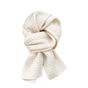 Chunky knit wool scarf in creamy white with cross weave texture on a plain background