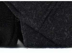 Close-up of winter hat featuring warm wool texture and thick ribbed knit stitching details