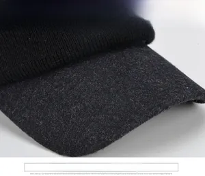 Close-up of wide-brimmed knitted peak cap with thick wool fabric for winter warmth