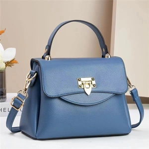Chic foggy blue lychee pattern leather handbag with gold triangle lock and shoulder strap