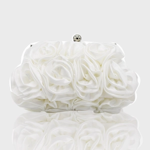 Detailed view of white satin evening clutch featuring handcrafted 3D rose flower textures