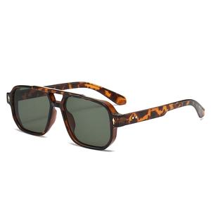 Classic tortoise shell aviator sunglasses with green lenses and gold rivet accents