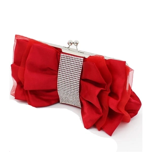 Detail of red satin evening bag with ruched fabric and sparkling rhinestone band