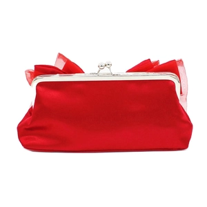 Detail of red satin evening bag with silver metal frame and elegant tulle bow top