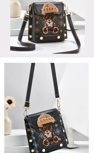 Detailed close-up of patterned crossbody phone bag with 3D teddy bear and knit hat