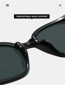 Detail of comfortable integrated nose support on black folding sunglasses
