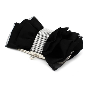 Detail of black satin clutch bag featuring a pleated bow and sparkling rhinestone band