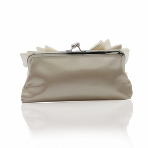 Close-up of beige satin evening clutch bag with elegant folds and silver clasp closure